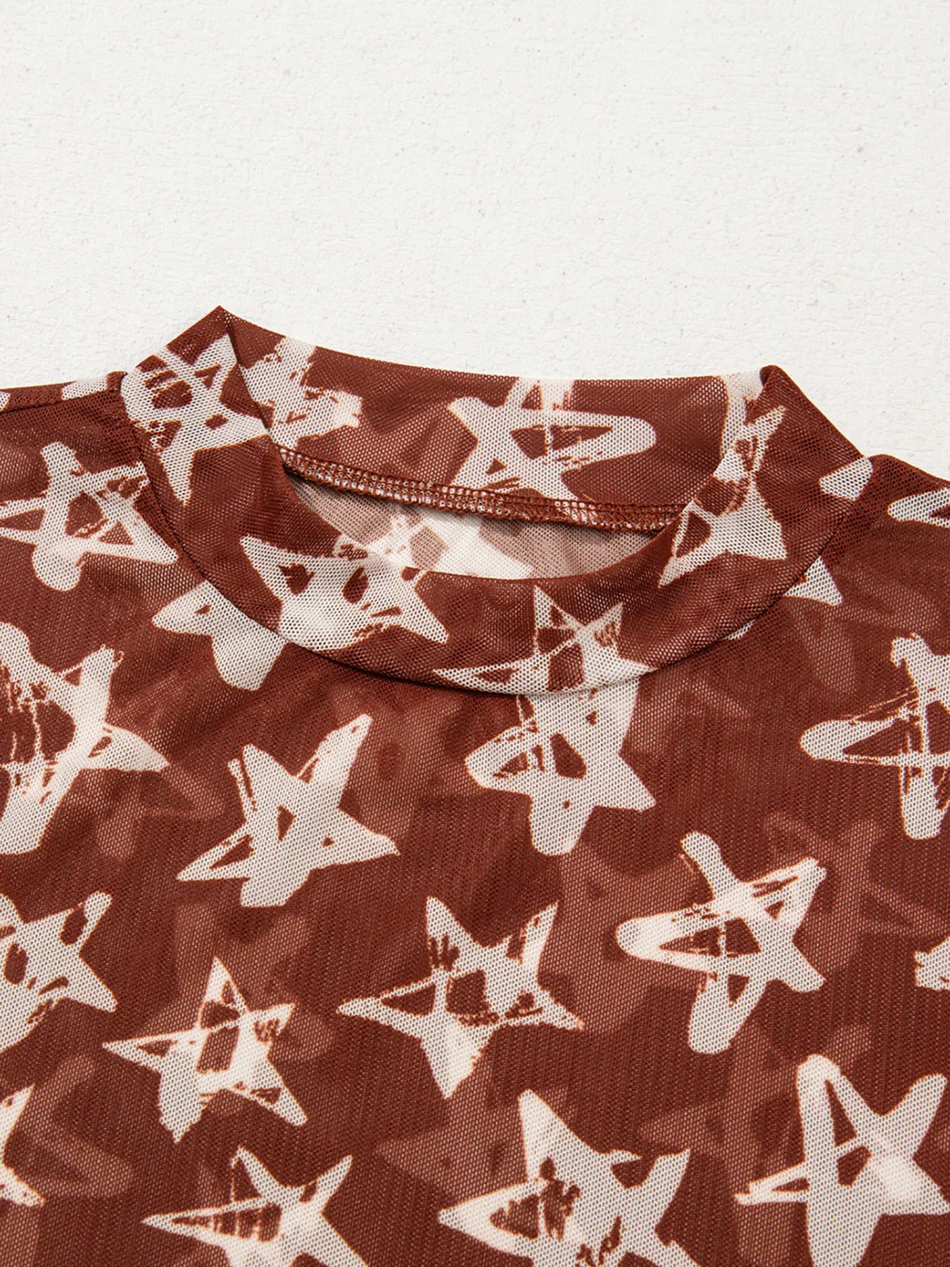 Celestia Star Print Long Sleeve Sheer Mock Neck Top