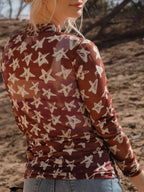 Celestia Star Print Long Sleeve Sheer Mock Neck Top