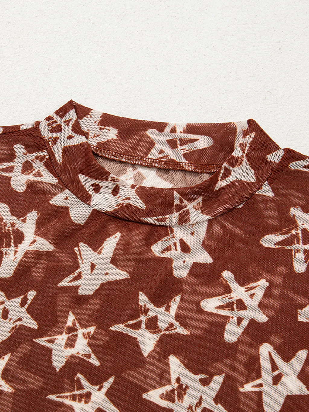 Celestia Star Print Long Sleeve Sheer Mock Neck Top
